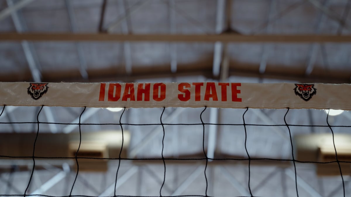 Idaho State volleyball net with red Idaho State logo on the banner at the top of the net